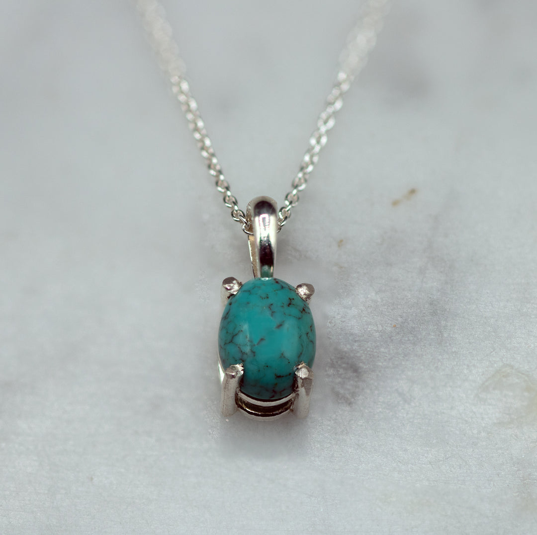 Turquoise in silver pendant