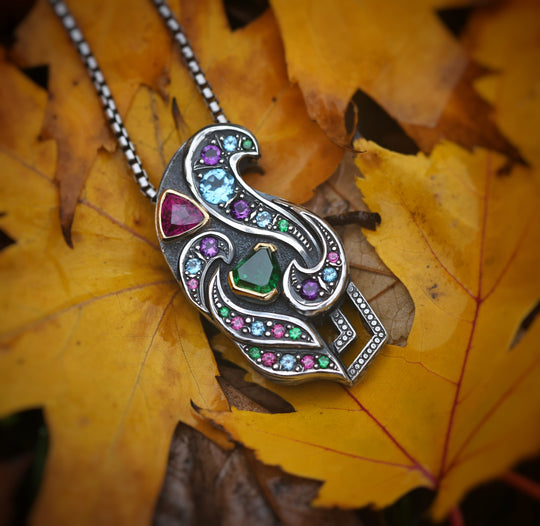 Silver and gold garnet pendant