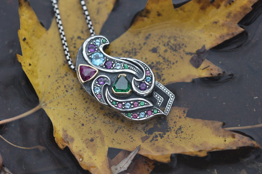 Silver and gold garnet pendant