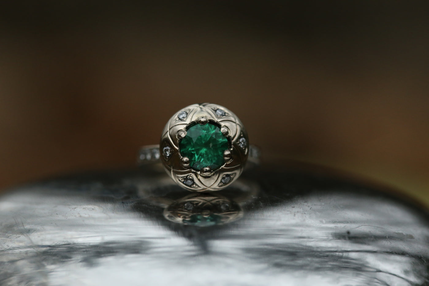 Emerald white gold engagement ring