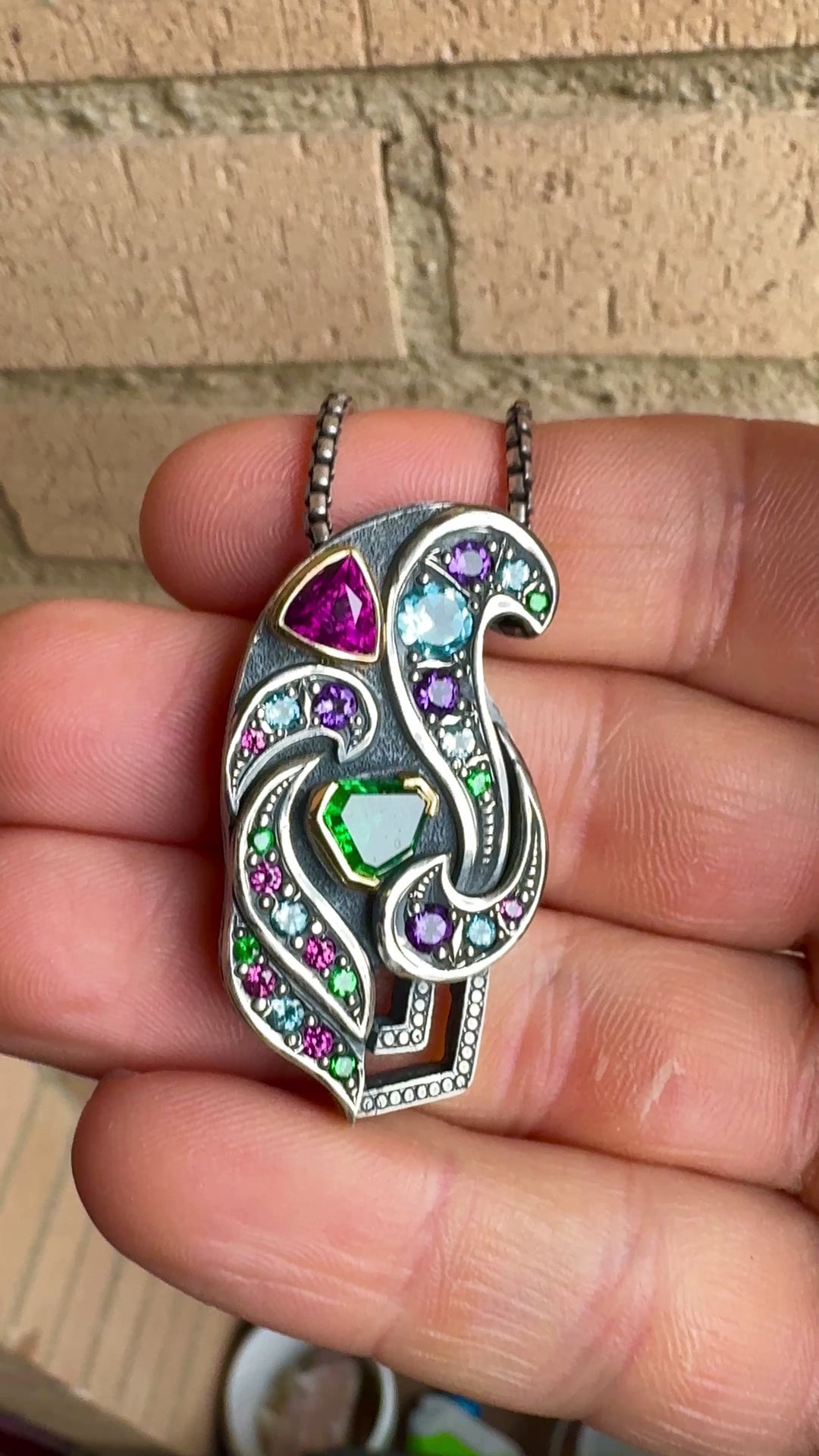 Silver and gold garnet pendant