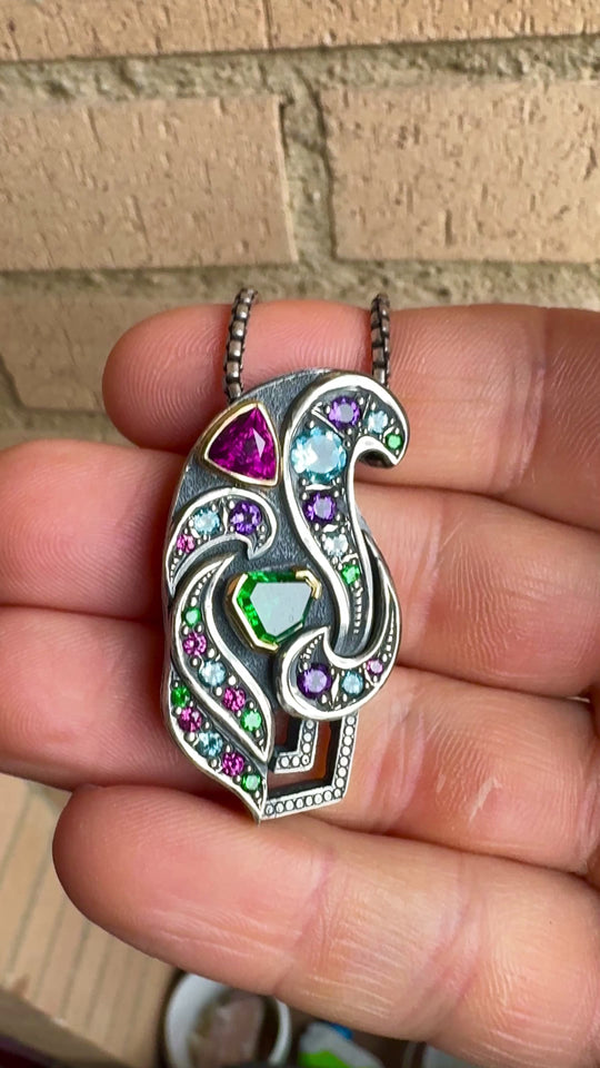 Silver and gold garnet pendant